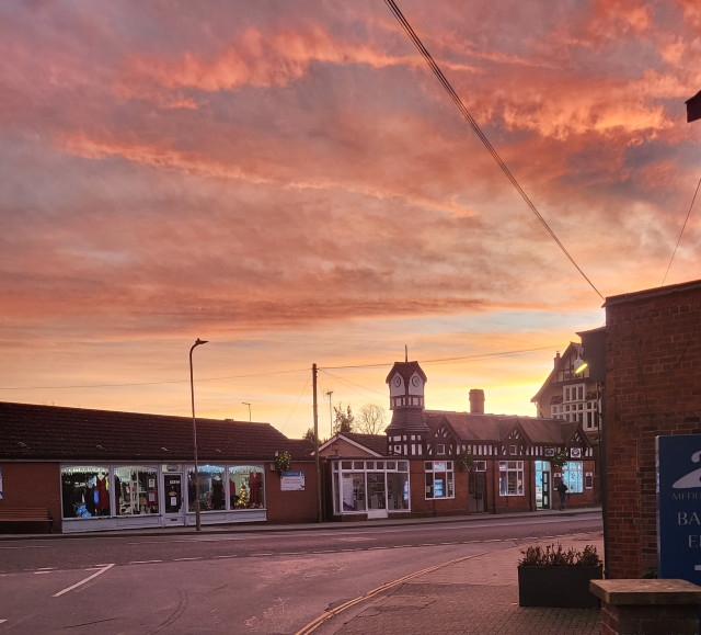 Genuine view of Clocktower Crystals and the Woodhall Spa clocktower at sunset